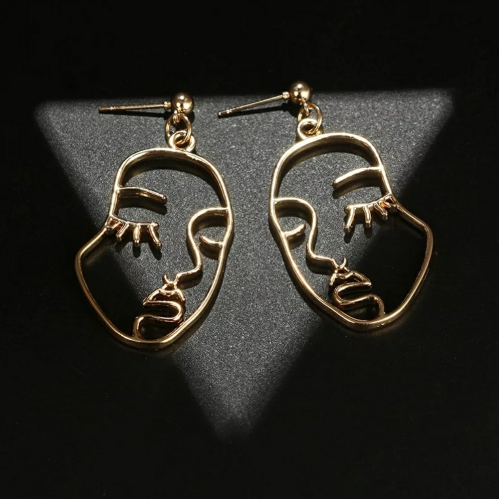 Gold face drop earrings